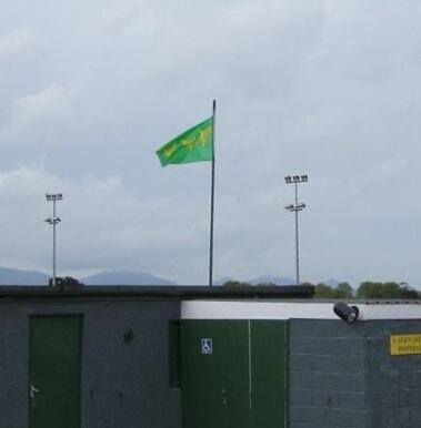 Caernarfon Town Football Club, The Oval, flies the Caernarfonshire county flag 2012
