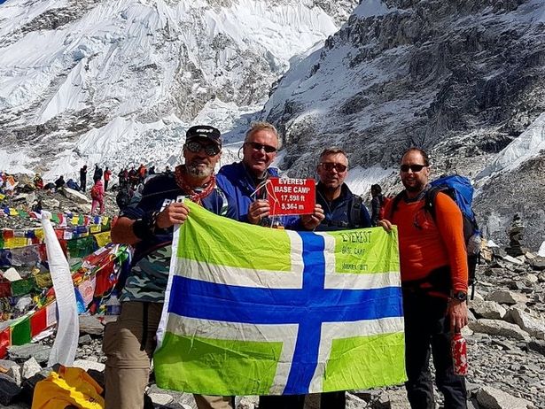 Paul Hooper, far left, and his friends with the Gloucestershire flag at Everest base camp.jpg