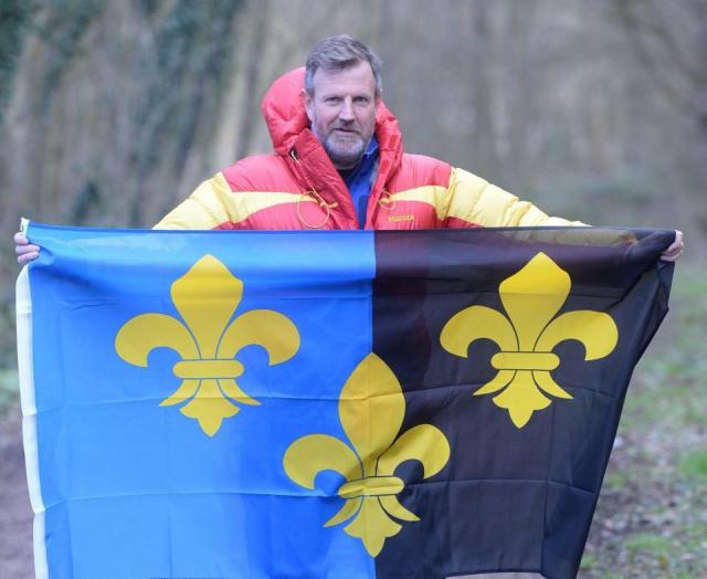 Local businessman Paul Fosh who took along his county flag when he set out on an Arctic trek for charity.jpg