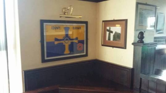A County Durham flag made of glass! On display in the Wheatsheaf Public House in Chilton, County Durham.