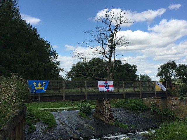Looking west over the River Waveney, , marked by respective county flags and the flag of East Anglia in the centre..jpg